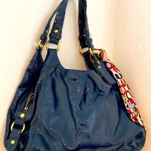 Coach purse in shiny dark blue color. Perfect lining and no marks.
